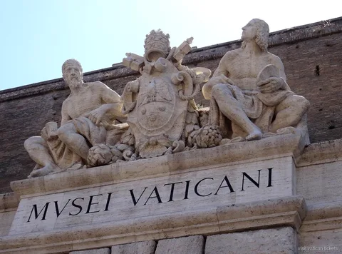 Vatican Museums gallery with frescoed ceiling on the guided tour